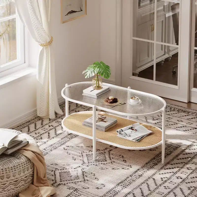 Tavolino da salotto ovale bohémien a 2 livelli in rattan con ripiano in vetro temperato e struttura in metallo